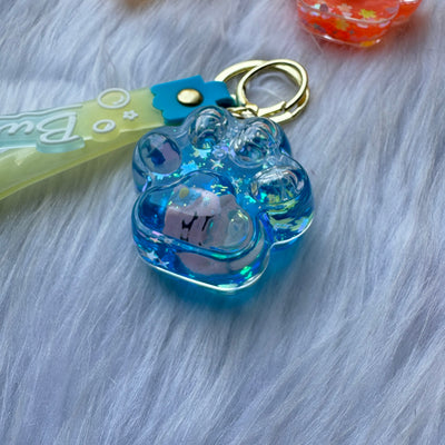 Unicorn inside paw water glitter keychain
