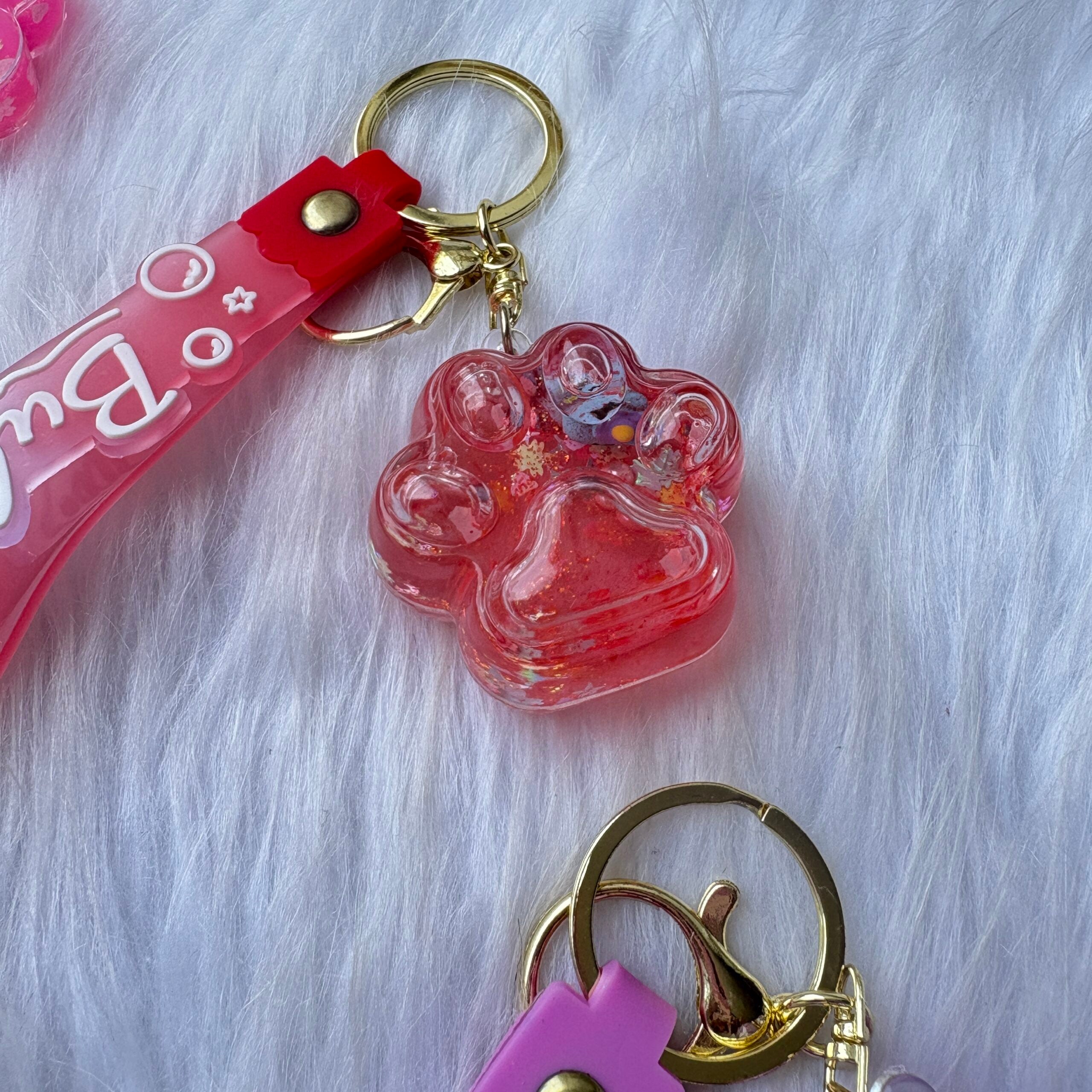Unicorn inside paw water glitter keychain