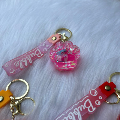 Unicorn inside paw water glitter keychain
