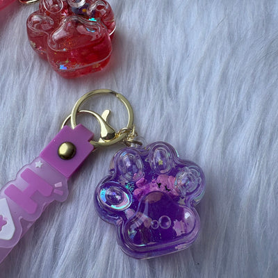 Unicorn inside paw water glitter keychain