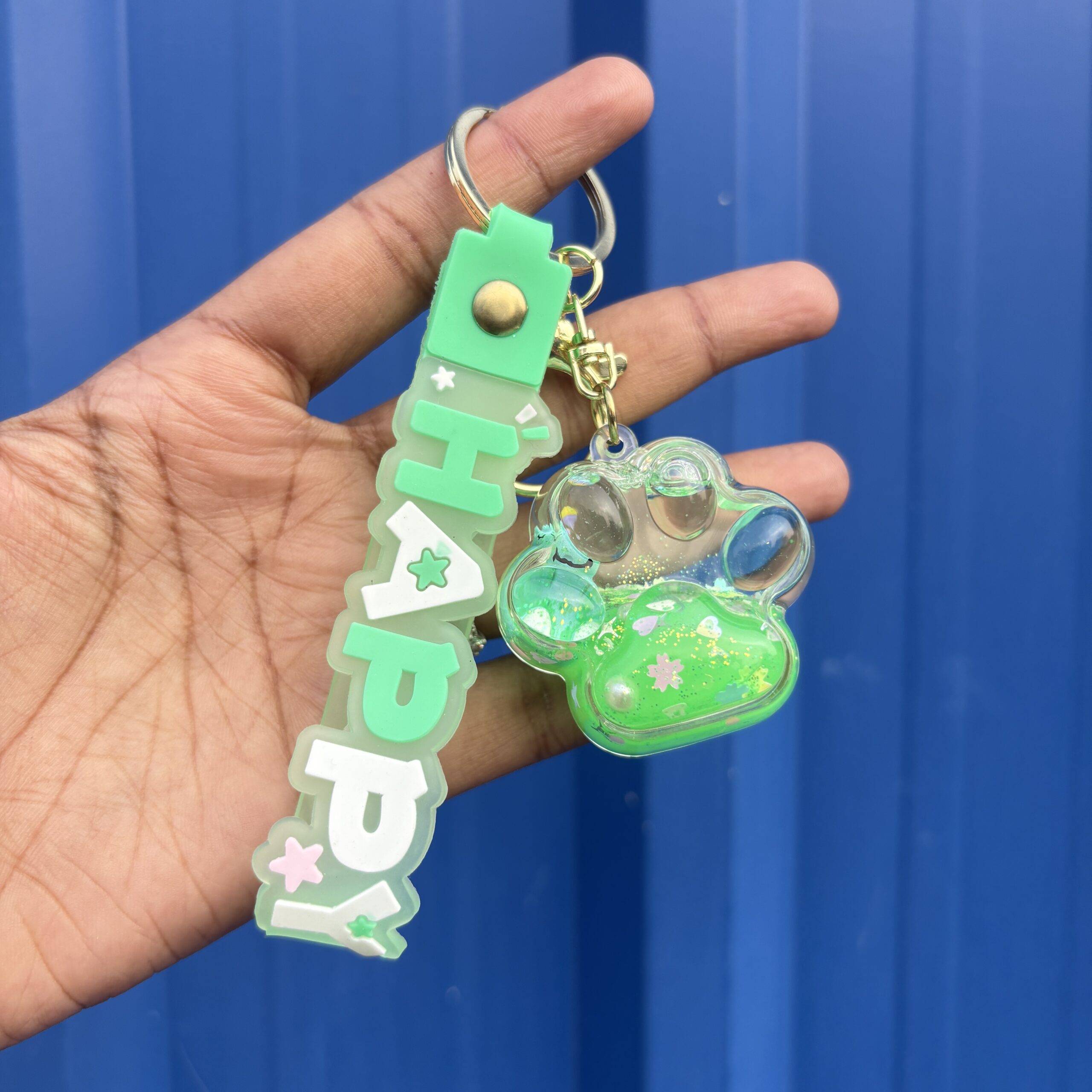 Unicorn inside paw water glitter keychain