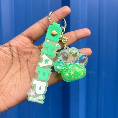 Unicorn inside paw water glitter keychain