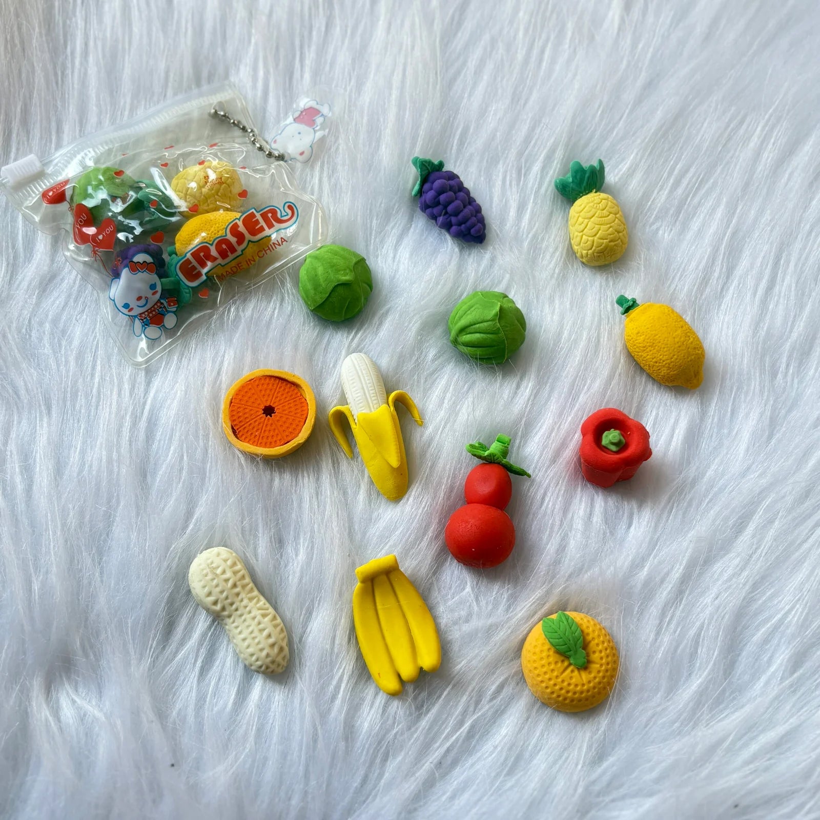 Set of 4 vegetable erasers in a pouch